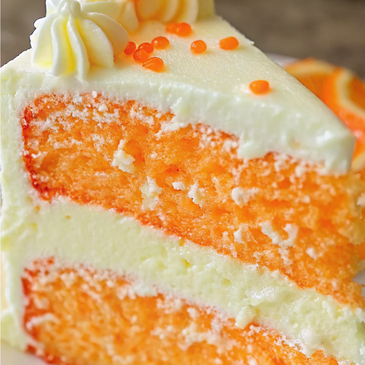 Orange Creamsicle Cake in a white plate