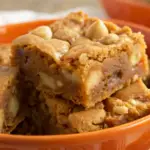 Chewy Butterscotch Blondies in an orange bowl